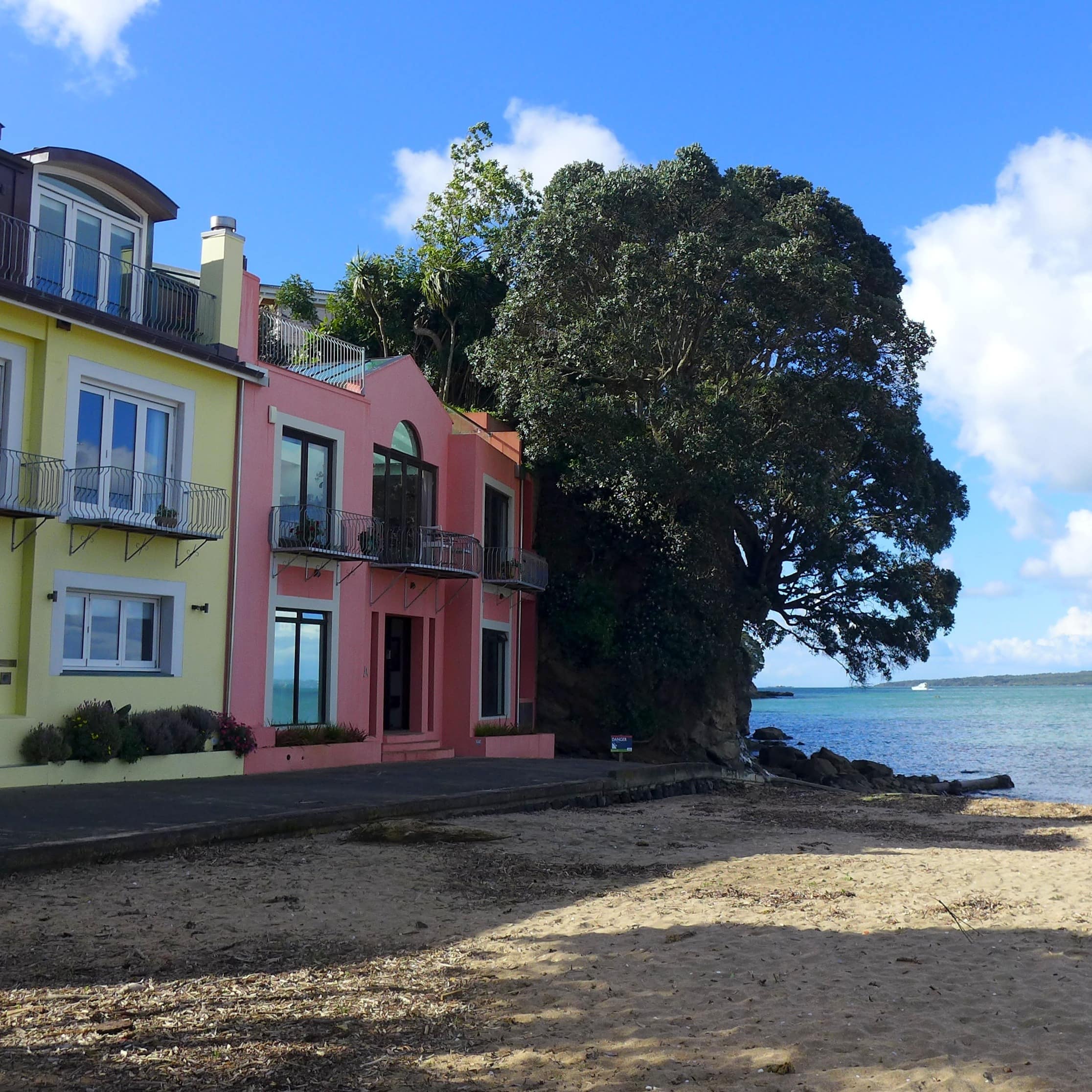Pink and yellow pastel homes along the beach